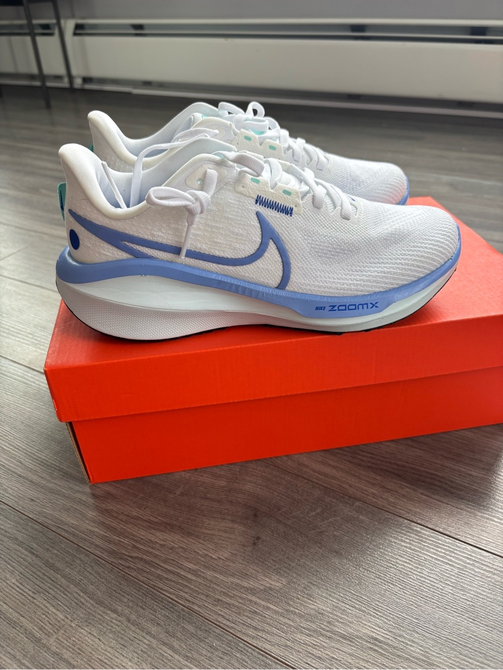 Nike White Running Sneakers with Light Blue Accents
